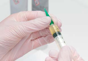 Attaching dispensing tip to syringe