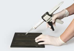 Applying glue to carrier material