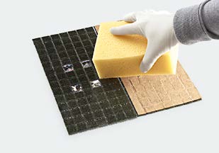 Removing excess tile glue before curing