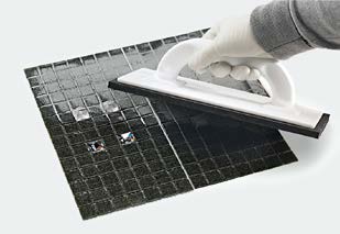 Removing paper support and grouting mosaic