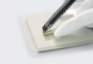 Cutting protective film around cavities