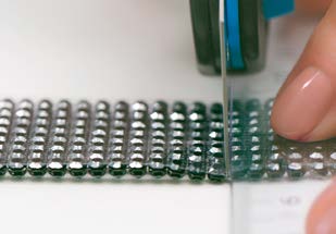 Cutting transparent film between Crystal Mesh rows