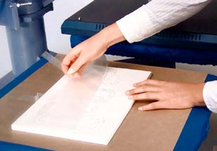 Transparent transfer film removed at an acute angle after cooling