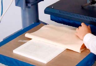 Carrier material positioned in a heat press for Crystal Diamond Transfer application