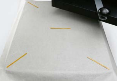 Temperature measuring strips on a heat press