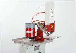 Semi-automatic attaching machine