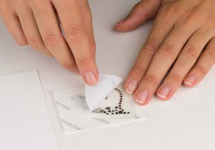 Peeling the white protective film from Crystal-it Infinity
