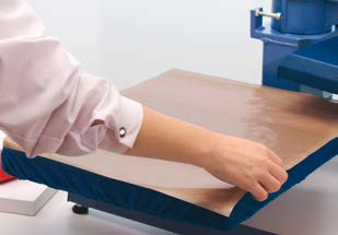 Using Teflon foil to protect a heat press