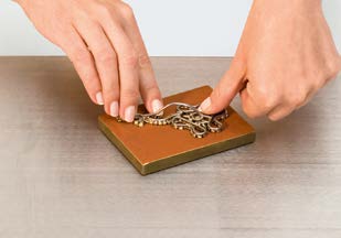 Press the original model into a suitable impression material.